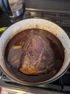 Putting the meat back into the pan