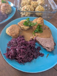 Sauerbraten with bread dumplings and red cabbage