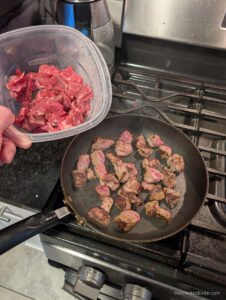 Searing the meat in badges for Goulash