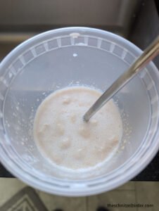 Bubbling yeast in some of the milk and sugar for authentic German Hefezopf