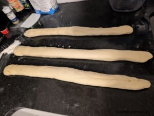 Three nearly equal strains for braided sweet bread (Hefezopf)